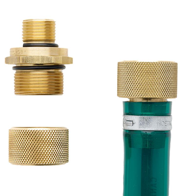 Brass plumbing fitting and green valve on a white background