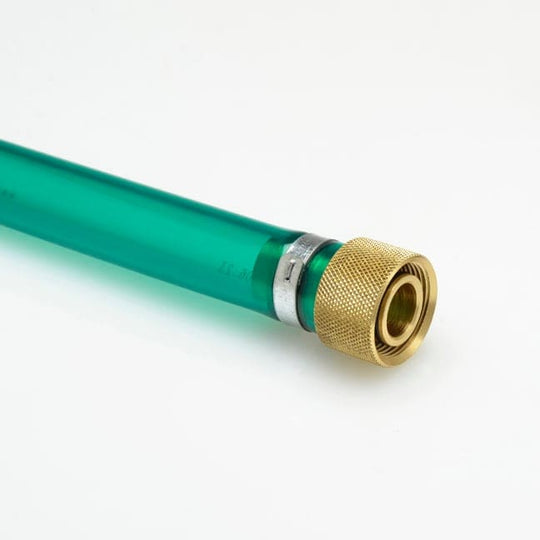 Close-up of a green and gold straight No-Spill drainer on a white background