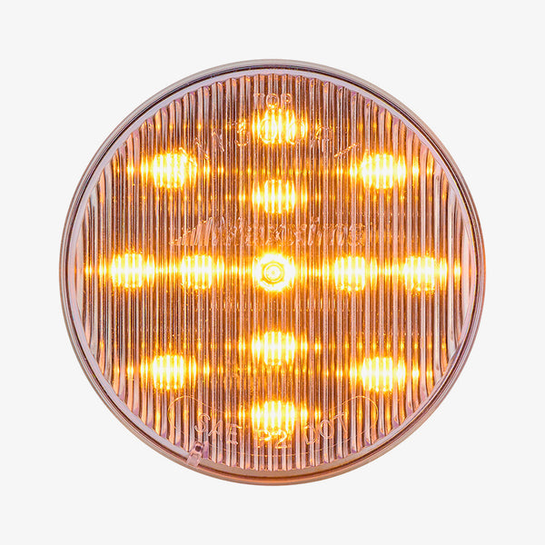 Round amber light on a white background