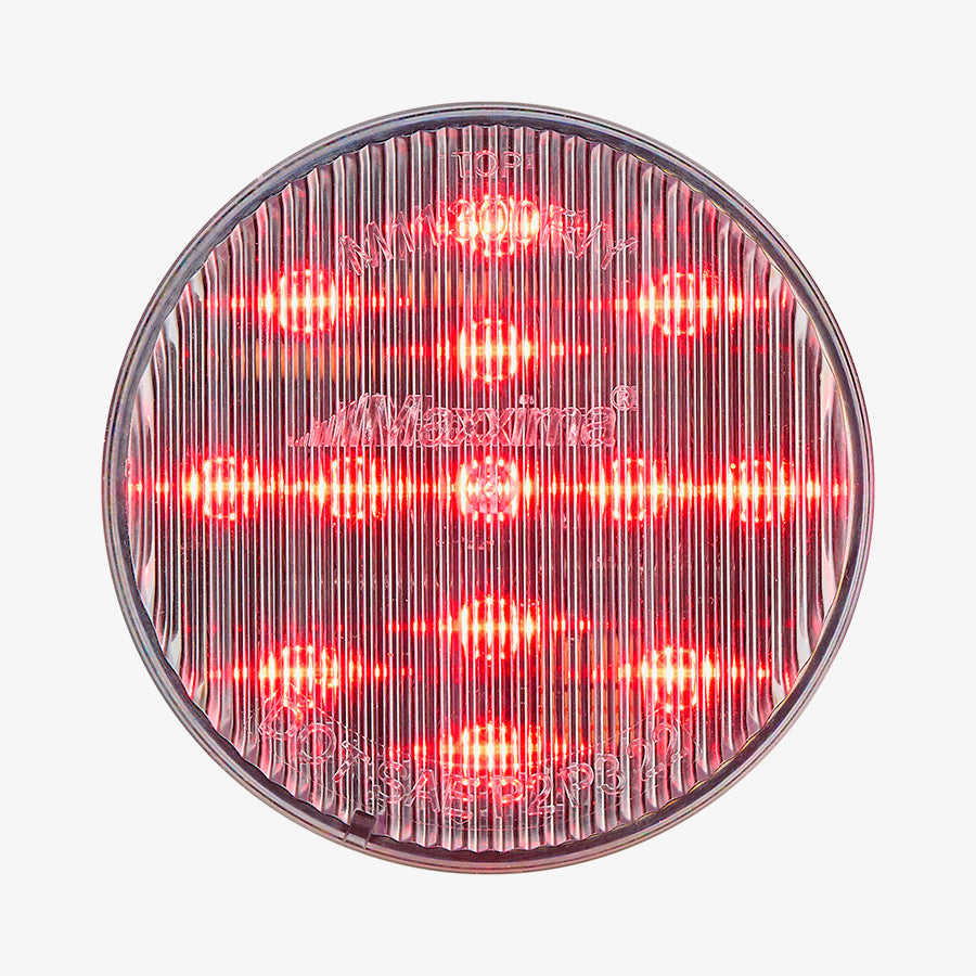 Round red light with a clear cover on a white background