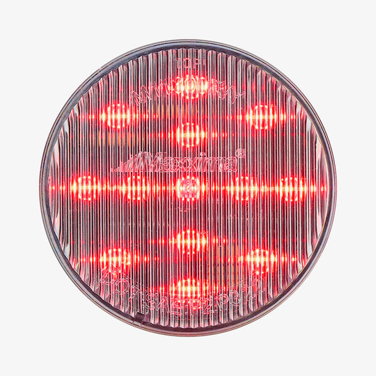 Round red light with a clear cover on a white background