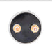 Black circular object with gold hexagonal connectors on a white background