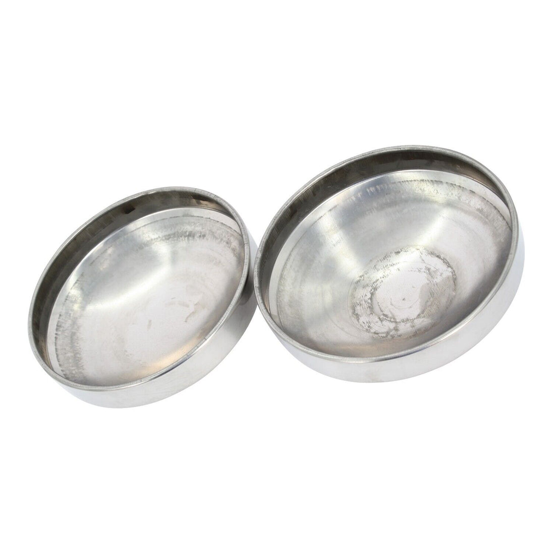 inside of two Stainless steel hub cap on a white background