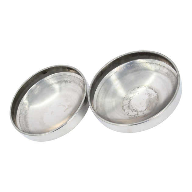 inside of two Stainless steel hub cap on a white background